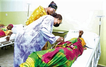 Lordina Mahama (right) interacting with one of the patients admitted to the ward